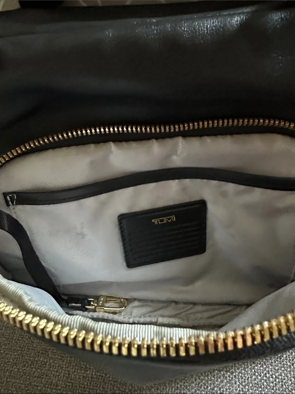 Tumi Leather Adrian Voyageur with Gold Hardware